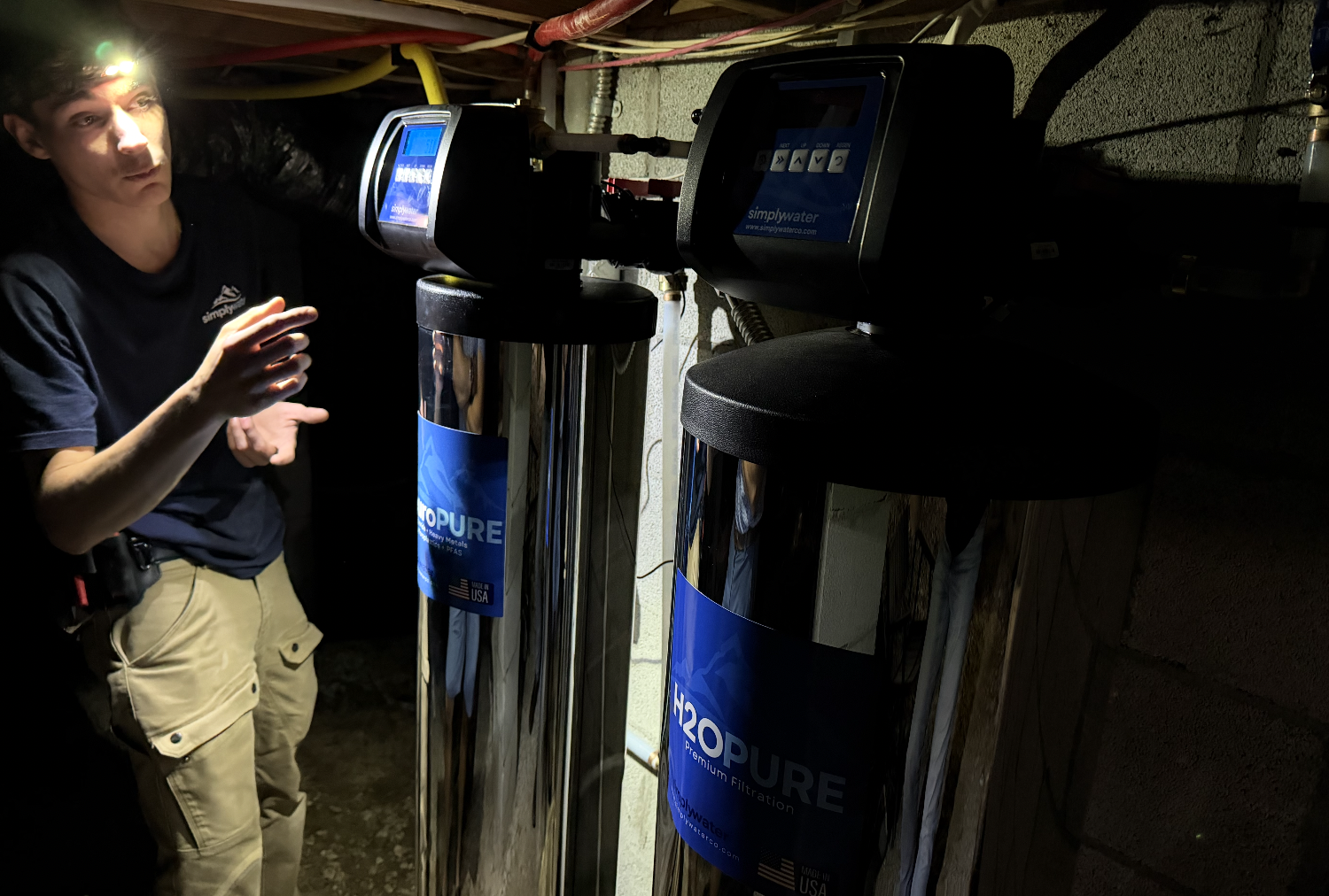 Simply Water service technician inspecting a residential installation