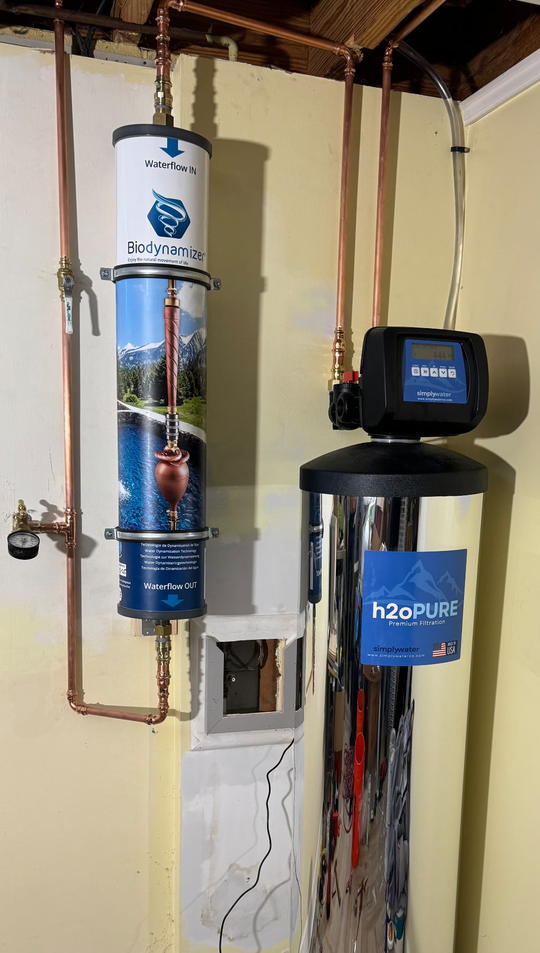Wall-mounted Biodynamizer and H2OPURE filtration tank in a residential installation
