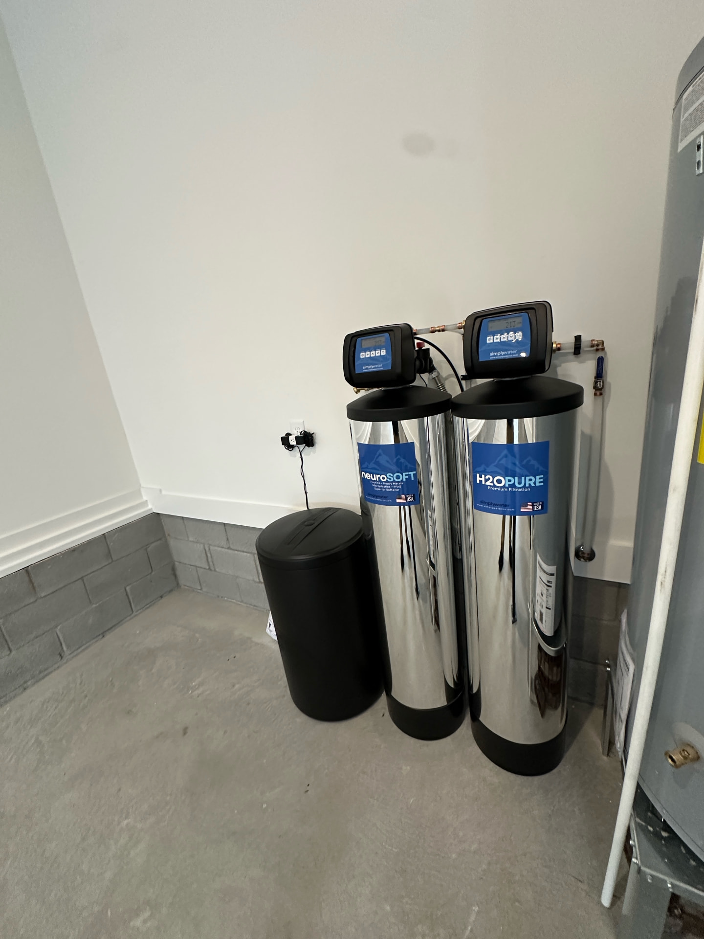 Compact two-tank Simply Water installation in a residential utility area